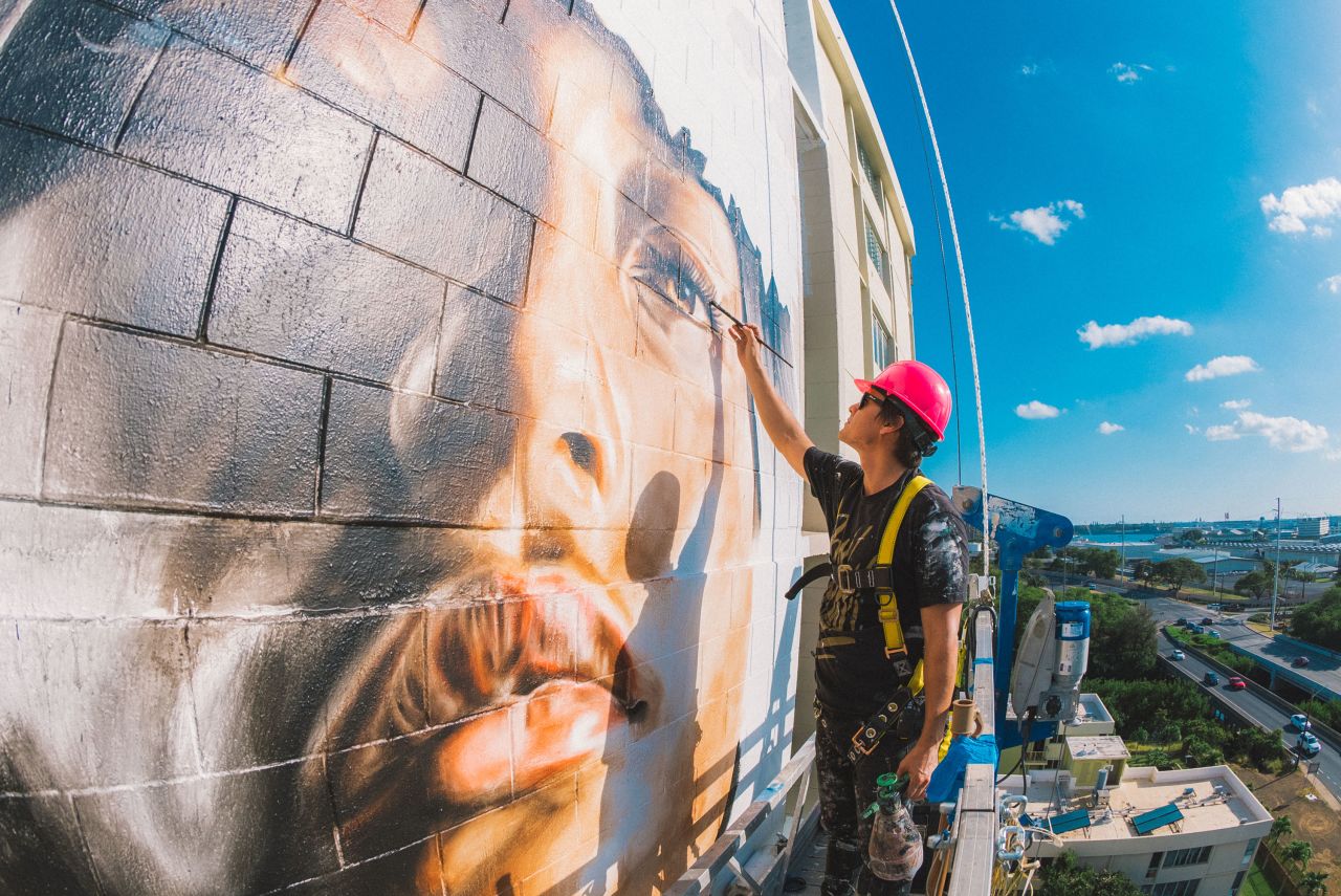 Kamea Hadar scales buildings for weeks at a time to complete stories-tall murals.