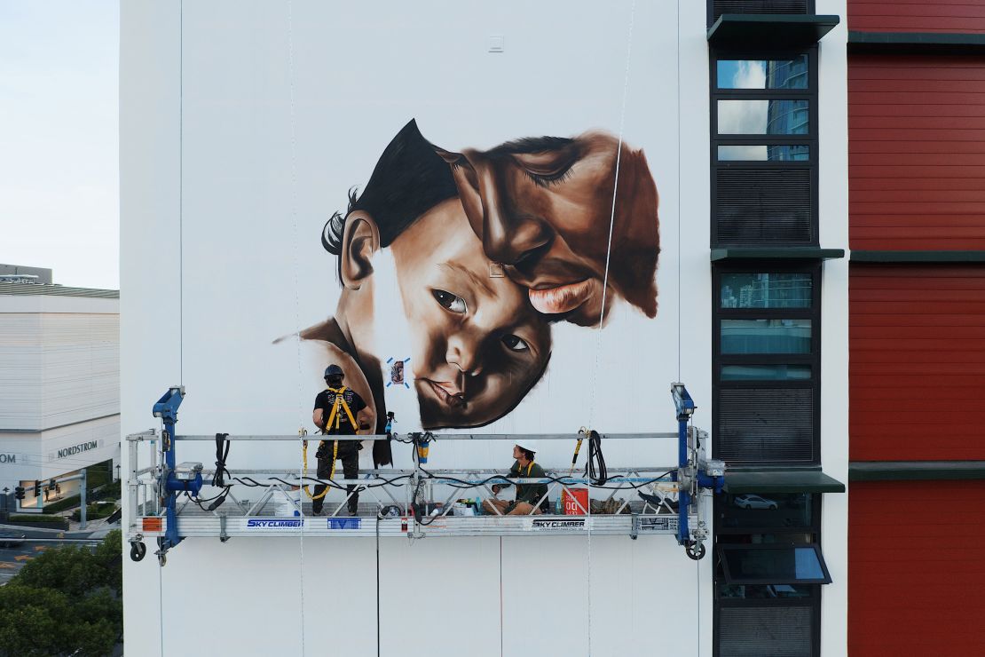 Kamea Hadar's 10-story tall mural "Huli" depicts a father and daughter.