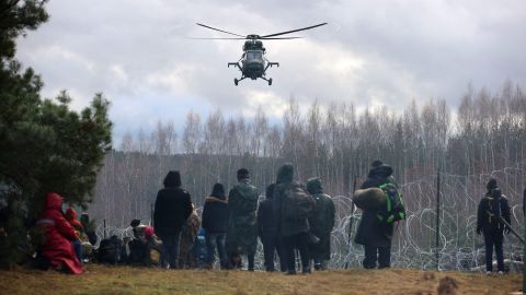 A picture taken on Monday shows migrants at the Belarusian-Polish border in the Grodno region. 
