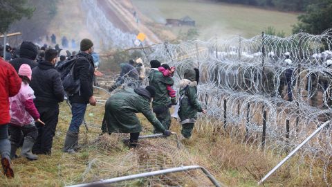 Poland said Monday that hundreds of migrants in Belarus were descending on its border aiming to force their way into the EU member in what NATO slammed as a deliberate tactic by Minsk. 