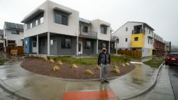 Former fossil fuel industry worker Dar-Lon Chang stands outside his net-zero community of Geos in Arvada, Colorado. 