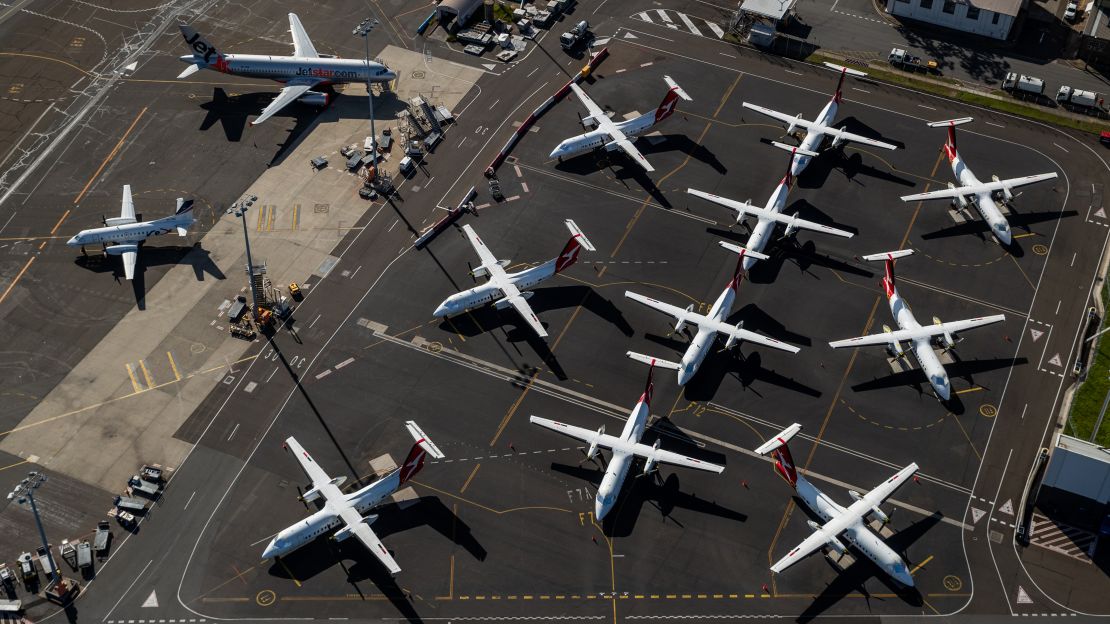 Air travel shut down in 2020 amid the Covid-19 pandemic. Pictured here: grounded Qantas planes at Sydney Airport in April 2020.
