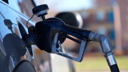 A motorist fills a vehicle with gasoline at a Shell station Friday, Nov. 5, 2021, in southeast Denver. (AP Photo/David Zalubowski)