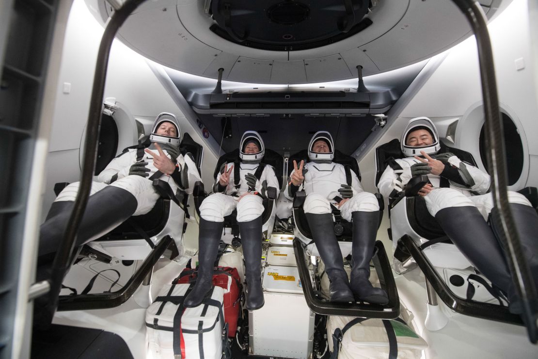 ESA (European Space Agency) astronaut Thomas Pesquet, left, NASA astronauts Megan McArthur and Shane Kimbrough, and Japan Aerospace Exploration Agency (JAXA) astronaut Aki Hoshide, right, are seen inside the SpaceX Crew Dragon Endeavour spacecraft onboard the SpaceX GO Navigator recovery ship shortly after having landed in the Gulf of Mexico off the coast of Pensacola, Florida, Monday, Nov. 8, 2021.