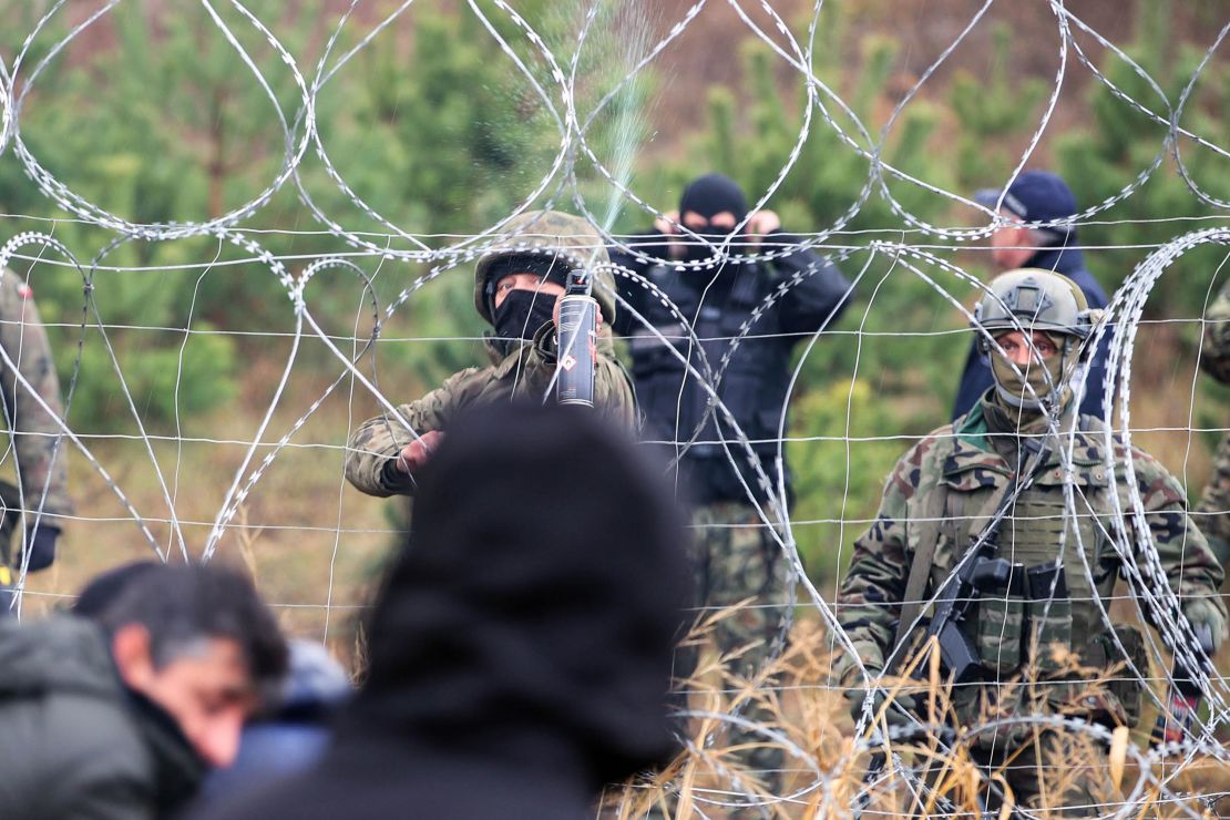 Polish police officers stand guard at an area by the border on Monday.
