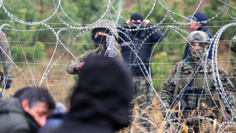 Polish police officers stand guard at an area by the border on Monday.
