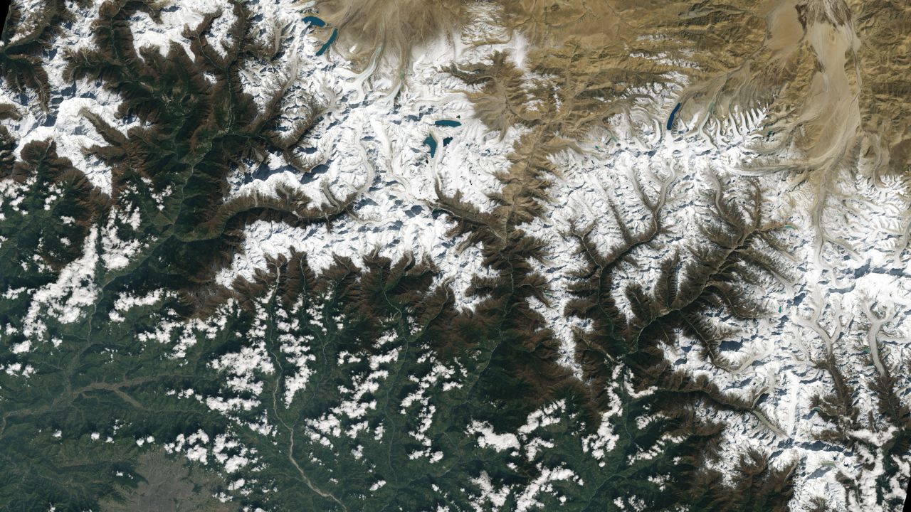 The city of Kathmandu, Nepal, seen at the bottom left of this Landsat 9 image, lies in a valley south of the Himalayan Mountains between Nepal and China. Glaciers, and the lakes formed by glacial meltwater, are visible in the top middle of this image.