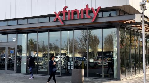 A pedestrian walks by a Comcast Xfinity retail store on January 23, 2020 in San Mateo, California. 