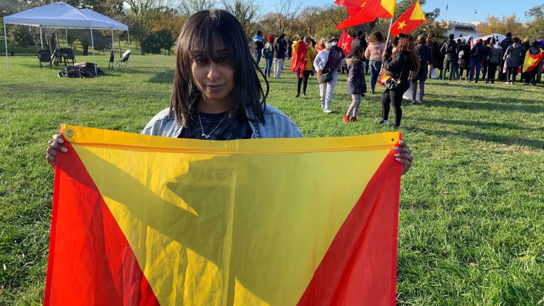 Su Solo holds the flag of Tigray, the northern Ethiopian region where her mom lives. She says they haven't spoken in months due to a communications blackout.