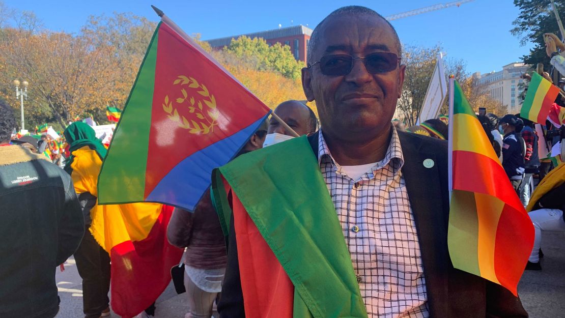 Berhanu Tadesse Taye, standing with protesters outside the White House, says he and many others support Ethiopian Prime Minister Adiy Ahmed.
