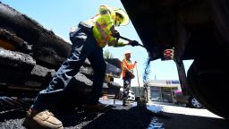 A roadworks crew work on road resurfacing on June 24, 2021 in Alhambra, California. 