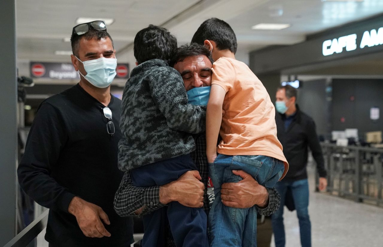 Abdul Shukoor embraces his nephews as they are reunited at an international airport in Chantilly, Virginia, on November 8. Shukoor had just flown in from Brussels, Belgium.