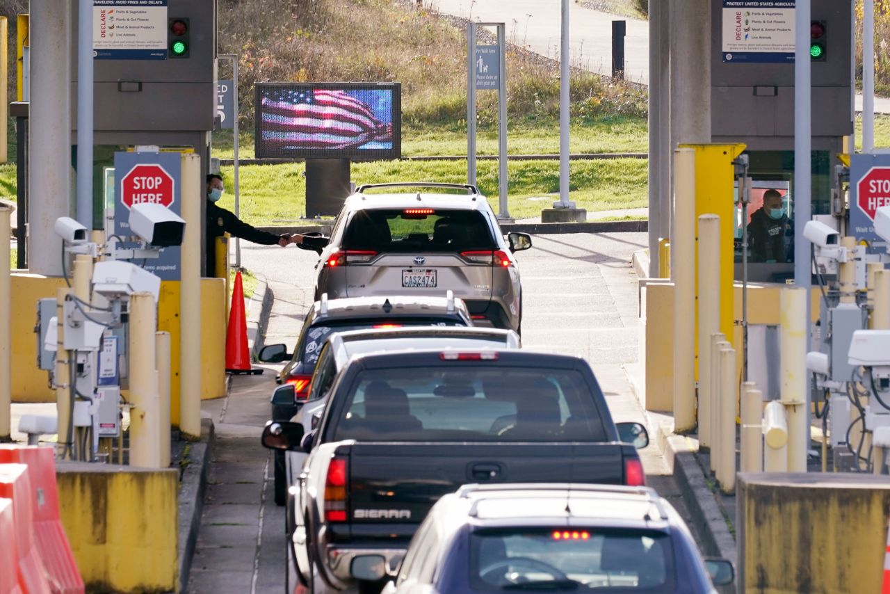 Cars from Canada line up to enter the United States at a border crossing in Blaine, Washington, on November 8.