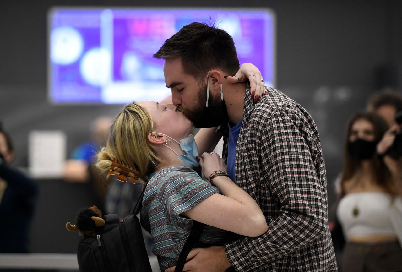A couple kisses each other as they are reunited in Chantilly, Virginia, on November 8.