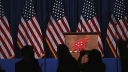 The GOP logo hangs on a podium during the Republican National Convention in Charlotte, North Carolina, U.S., on Monday, Aug. 24, 2020. Most of the four-day RNC meeting will be held virtually, but delegates are meeting in Charlotte, the original site of the convention before worries about the coronavirus shut it down, to formally nominate Trump and Vice President Pence for a second term. Photographer: Travis Dove/The New York Times/Bloomberg via Getty Images