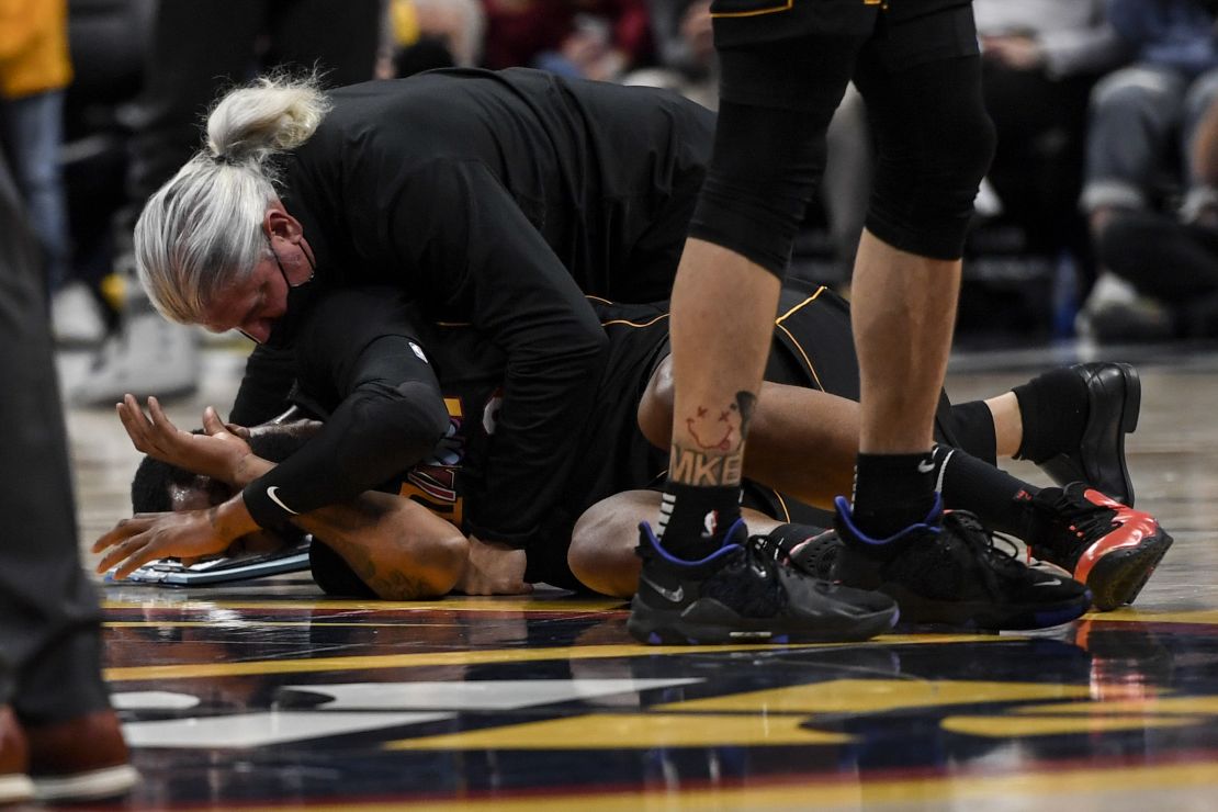 Morris lies on the ground after being pushed by Jokic. 