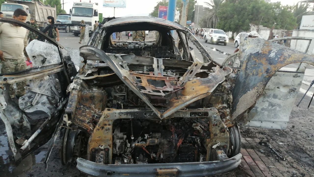 The wreckage of a car at the site of an explosion that killed a journalist in Aden, Yemen on Tuesday.