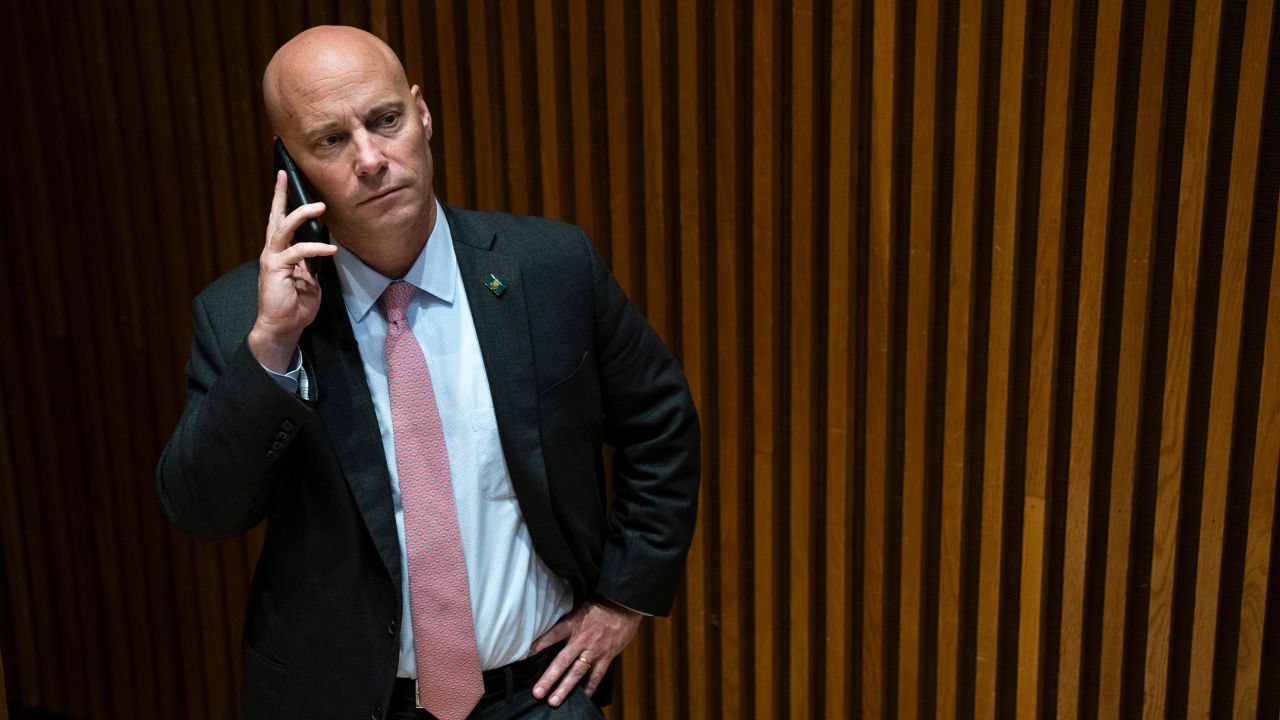 Marc Short, then chief of staff to Vice President Mike Pence, takes a phone call as Pence speaks with New York Police Department officers and personnel at NYPD headquarters in September 2019 in New York City.  