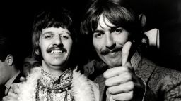 Ringo STARR and George HARRISON and BEATLES, L-R. Ringo Starr, George Harrison posed, doing thumbs up, at the 'All You Need Is Love' session at Abbey Road Studios, June 24, 2967