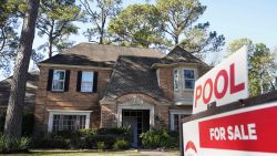 In this Wednesday, Jan. 13, 2021, file photo, a real estate sign is shown at a home for sale, in Houston.