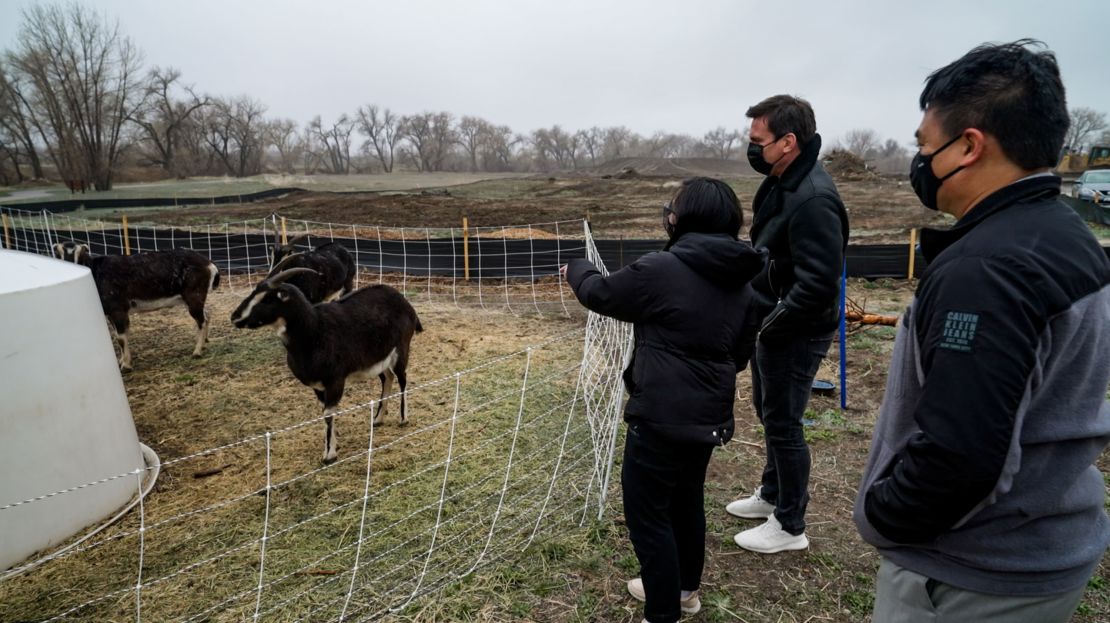 Dar-Lon Chang and his daughter with CNN's Bill Weir next to the herd of goats in Geos.