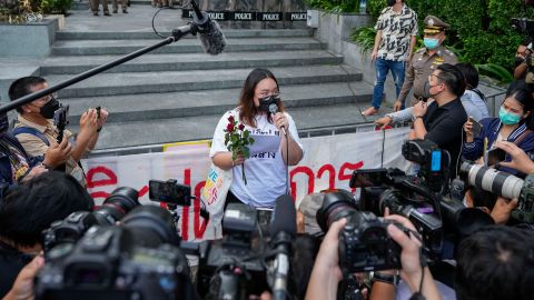 Pro-democracy activist Panusaya Sithijirawattanakul talks to the media after leaving the Constitutional Court where her protest activities came under legal review in Bangkok on November 10, 2021. 