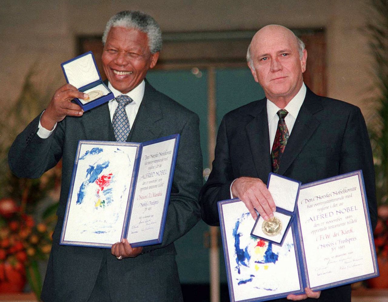 South African President Mandela and Deputy President de Klerk pose with their Nobel Peace Prize medals on December 10, 1993, in Oslo, Norway.