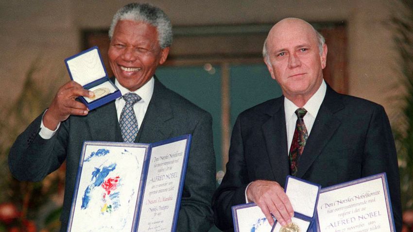 In this Dec. 10, 1993 file photo, South African Deputy President F.W. de Klerk, right, and South African President Nelson Mandela pose with their Nobel Peace Prize Gold Medals and Diplomas in Oslo. 