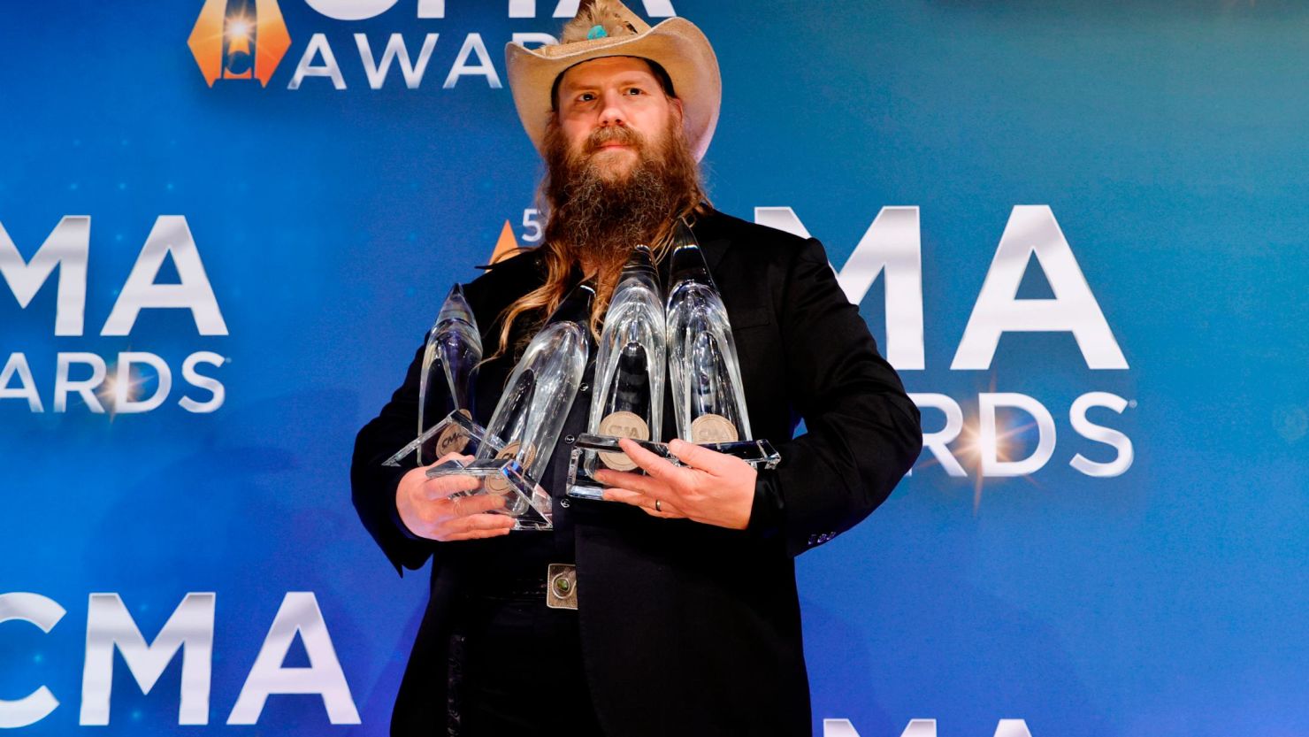 Chris Stapleton poses with his CMA awards on Wednesday night in Nashville.