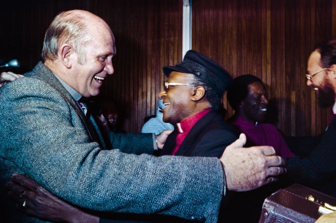 De Klerk, left, greets South African activist and Nobel Peace Prize and Archbishop <a href="index.php?page=&url=https%3A%2F%2Fwww.cnn.com%2F2013%2F01%2F25%2Fworld%2Fafrica%2Fdesmond-tutu-fast-facts%2Findex.html" target="_blank">Desmond Tutu</a>  in Johannesburg on June 29, 1987.