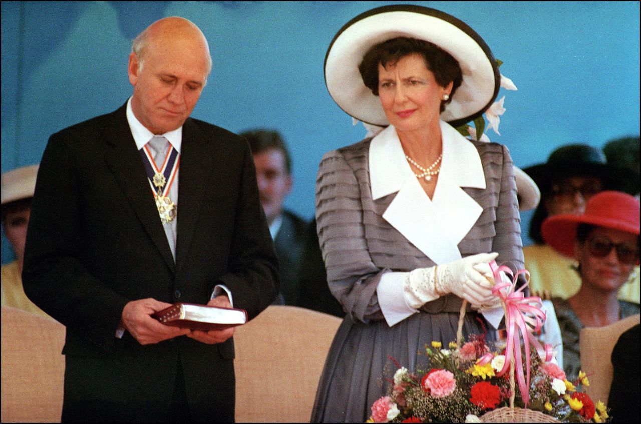 De Klerk stands next to Marike during a ceremony at which he was sworn in as South Africa's State President, on September 20, 1989.