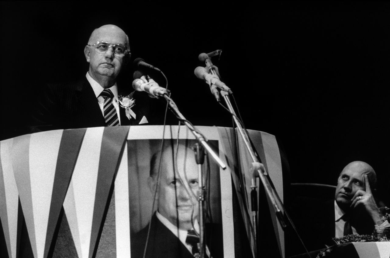De Klerk looks on as former President PW Botha speaks in 1990 at a National Party conference in Pretoria.