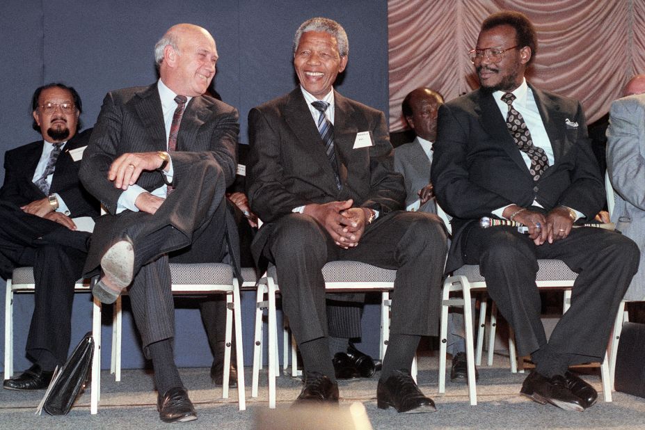 De Klerk, Mandela and president of the Inkatha Freedom Party Mangosuthu Buthelezi speak on September 14 1991, prior to the signing of a historic National Peace Accord in Johannesburg.