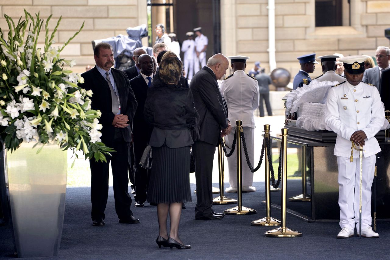 De Klerk stands beside the casket of Mandela on December 11, 2013, in Pretoria. Mandela died on December 5 at his home.