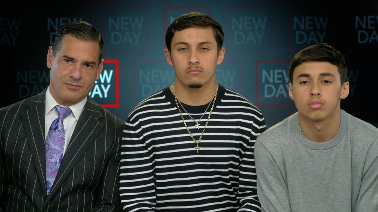 Jonathan and Bryan Espinoza and attorney Rick Ramos, left, speak to CNN's John Berman.