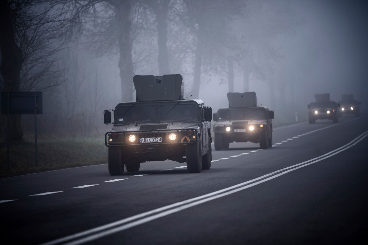 Humvees with the Polish Army travel to the Bruzgi-Kuznica border crossing on Thursday, November 11.