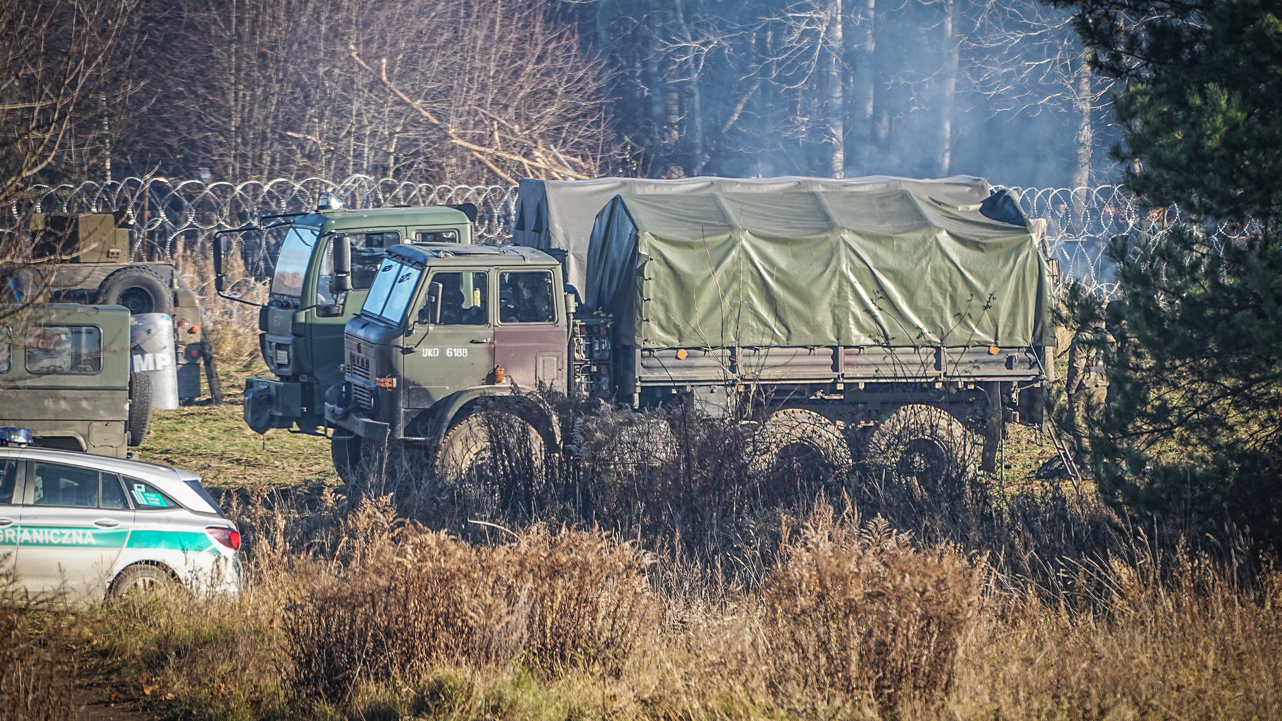 Polish army vehicles are seen near the Bruzgi-Kuznica border crossing on Tuesday, November 9.