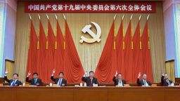 In this photo released by Xinhua News Agency, members of the Standing Committee of the Political Bureau of the Communist Party of China (CPC) Central Committee including Chinese President Xi Jinping, center, and Premier Li Keqiang, third right, raise hands as they attend the sixth plenary session of the 19th Central Committee of the Communist Party of China (CPC) in Beijing, Thursday, Nov. 11, 2021. Leaders of China's ruling Communist Party on Thursday set the stage for President Xi Jinping to extend his rule next year, praising his role in the country's rise as an economic and strategic power and approving a political history that gives him status alongside the most important party figures. (Xie Huanchi/Xinhua via AP)