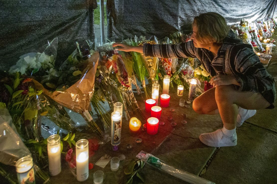 Hannah Longoria attends a makeshift memorial for those who died at the Astroworld Festival in Houston