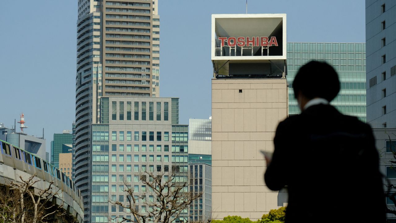 The logo of Japanese industrial group Toshiba is seen on top of its headquarters in Tokyo on April 7, 2021. 