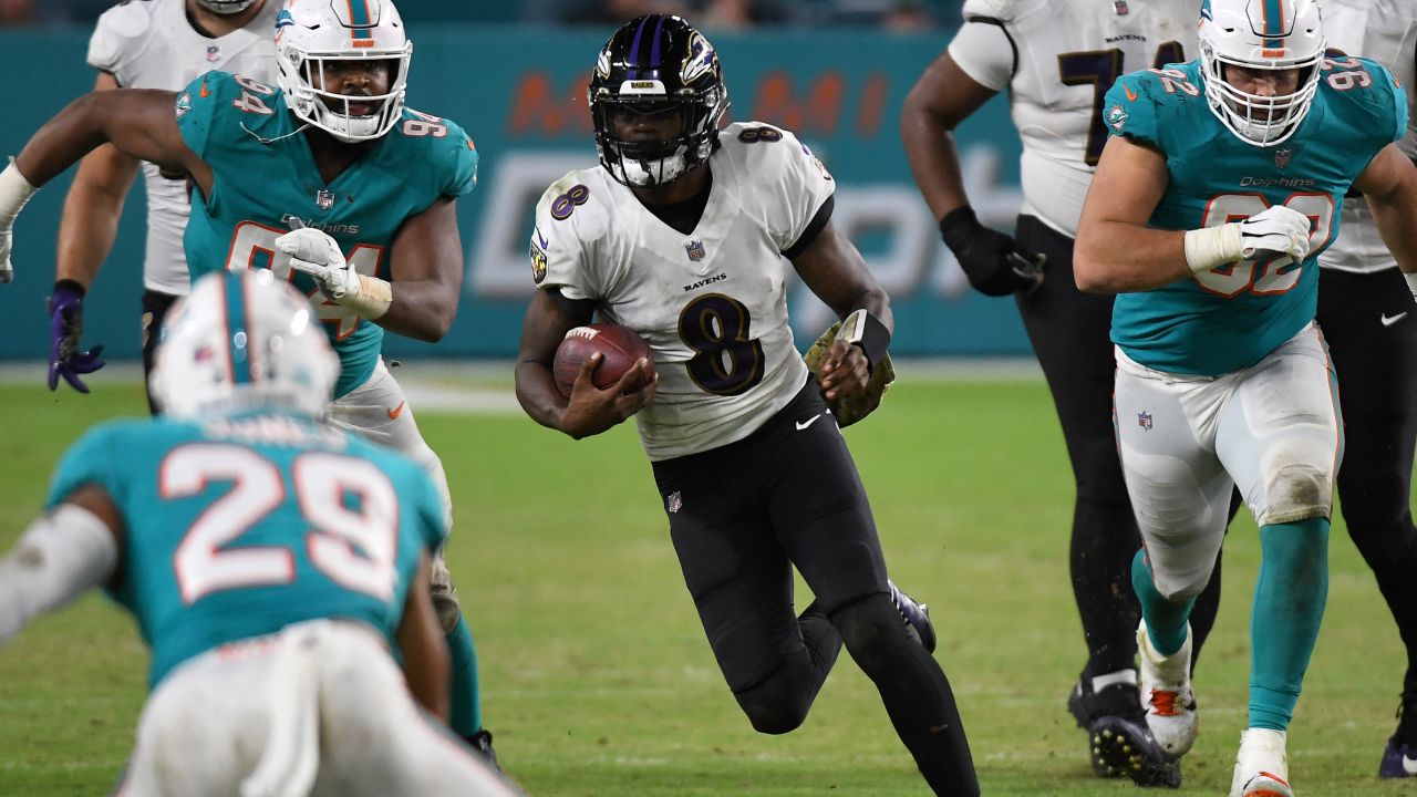 Jackson runs with the ball against the Miami Dolphins.