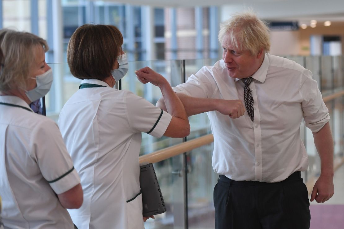 Boris Johnson meets medical staff during a visit to Hexham General Hospital on November 8, 2021 in northern England. 