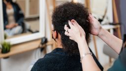 black woman hair salon STOCK
