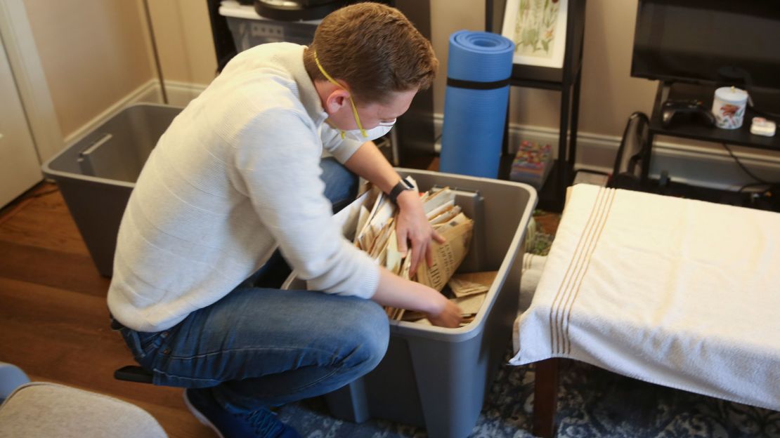 Regan Freeman looks through a container of racist material that belonged to Ku Klux Klan leader John Howard.