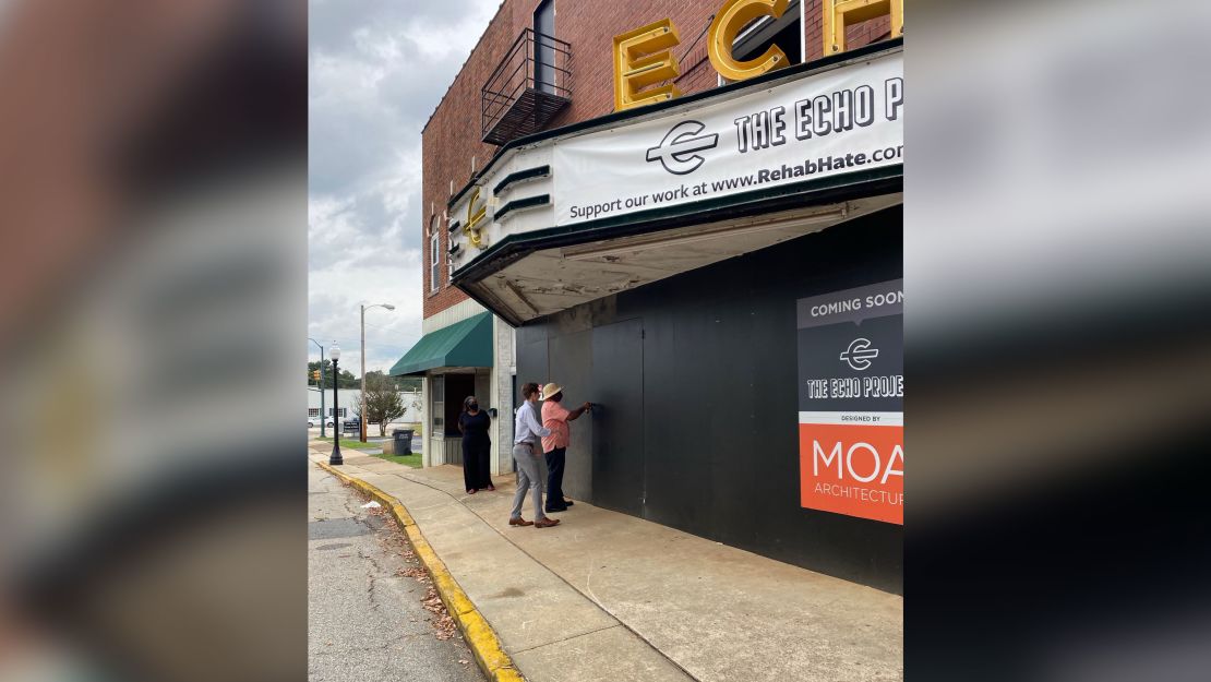 The Rev. David Kennedy and Regan Freeman stand outside the former Echo Theater.