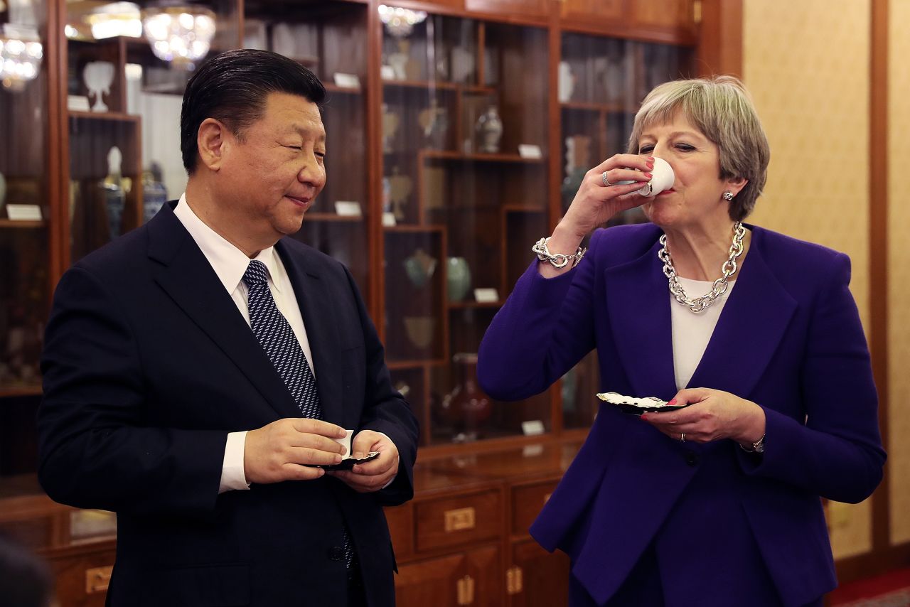 Xi and British Prime Minister Theresa May take part in a tea ceremony in Beijing in February 2018.