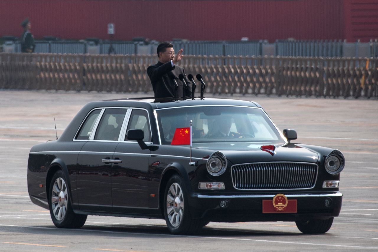 Xi waves from a car in October 2019 after inspecting the troops during a parade in Beijing.