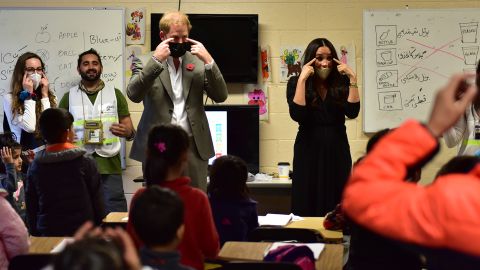 The couple join the children in singing the song "Head, Shoulders, Knees and Toes."