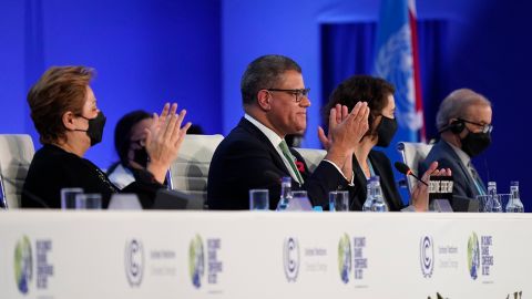 Britain's Alok Sharma, second left, President of the COP26 and Patricia Espinosa, left, UNFCCC Executive-Secretary applaud during the closing plenary session at the COP26 UN Climate Summit, in Glasgow, Scotland, Saturday, Nov. 13, 2021