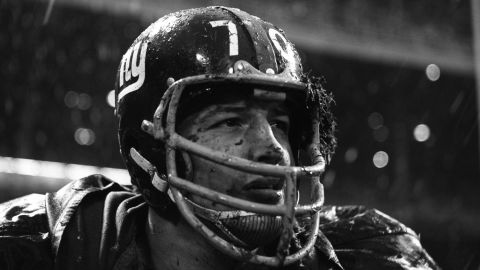 Linebacker Sam Huff of the New York Giants watches the action from the sidelines during a game on November 19, 1962 against the Philadelphia Eagles at the Yankee Stadium in New York